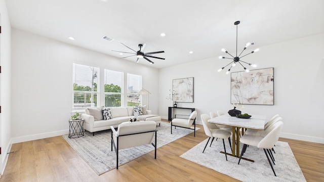 1813 Brooks St, Houston, TX 77026 - living area with a chandelier, recessed lighting, light wood-style flooring, and baseboards