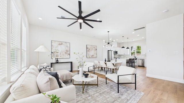 1813 Brooks St, Houston, TX 77026 - living area featuring light wood-style flooring, a ceiling fan, recessed lighting, and baseboards