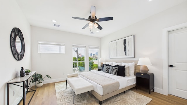 1813 Brooks St, Houston, TX 77026 - bedroom featuring light wood finished floors, baseboards, a ceiling fan, and recessed lighting