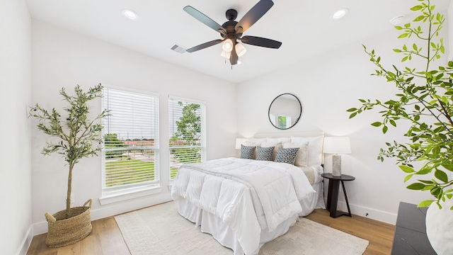 1813 Brooks St, Houston, TX 77026 - bedroom with light wood-type flooring, baseboards, a ceiling fan, and recessed lighting