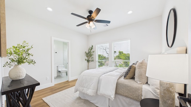 1813 Brooks St, Houston, TX 77026 - bedroom with light wood-type flooring, baseboards, ensuite bath, recessed lighting, and ceiling fan