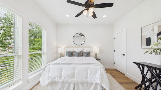 1813 Brooks St, Houston, TX 77026 - bedroom featuring multiple windows, wood finished floors, recessed lighting, baseboards, and a ceiling fan