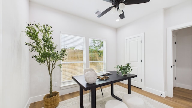 1813 Brooks St, Houston, TX 77026 - office with light wood-type flooring, ceiling fan, and baseboards