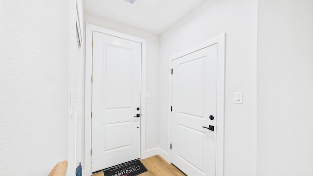 1813 Brooks St, Houston, TX 77026 - entryway with light wood-style floors and baseboards