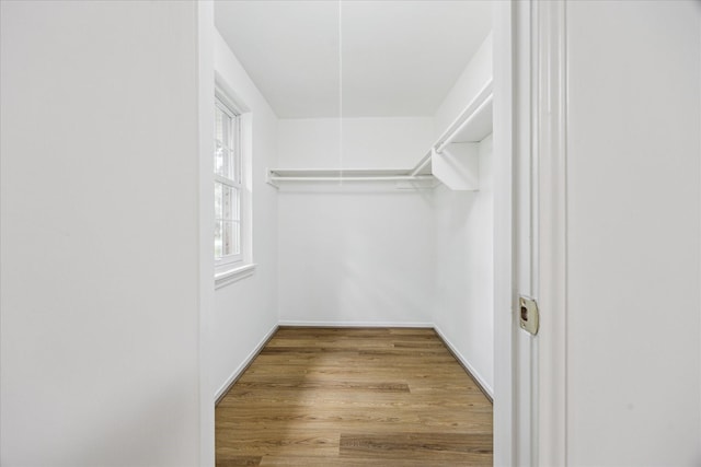 10715 Piping Rock Ln, Houston, TX 77042 - spacious closet featuring wood finished floors