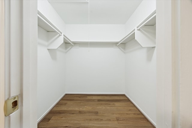 10715 Piping Rock Ln, Houston, TX 77042 - spacious closet featuring wood finished floors