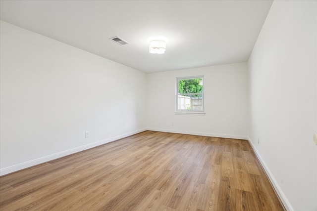 10715 Piping Rock Ln, Houston, TX 77042 - spare room with light wood-style floors and baseboards