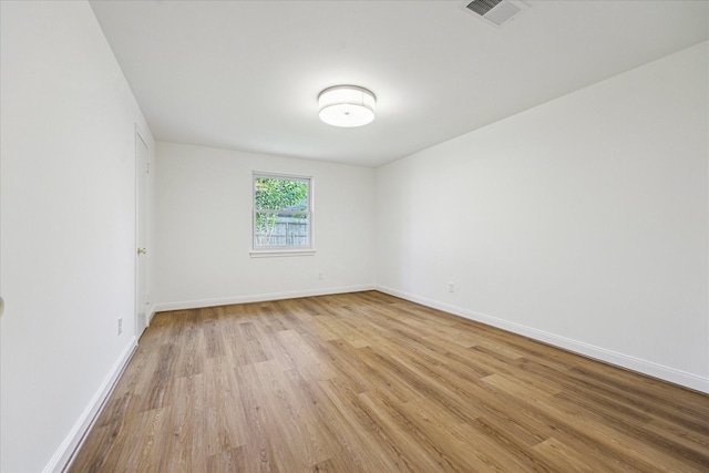 10715 Piping Rock Ln, Houston, TX 77042 - spare room featuring light wood-type flooring and baseboards