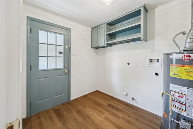 10715 Piping Rock Ln, Houston, TX 77042 - laundry area with cabinet space, gas water heater, dark wood-style floors, hookup for an electric dryer, and hookup for a washing machine