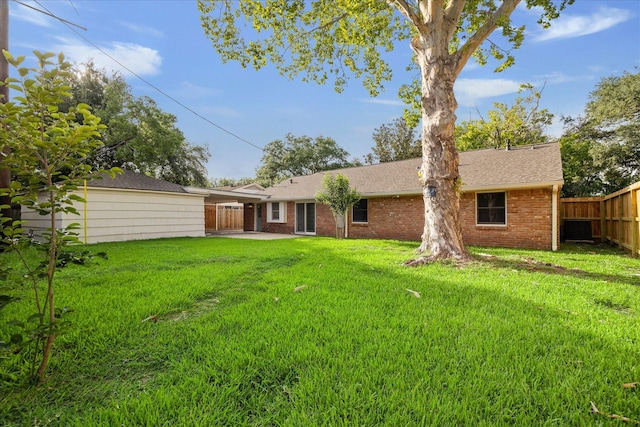 10715 Piping Rock Ln, Houston, TX 77042 - back of property featuring brick siding, roof with shingles, and a patio