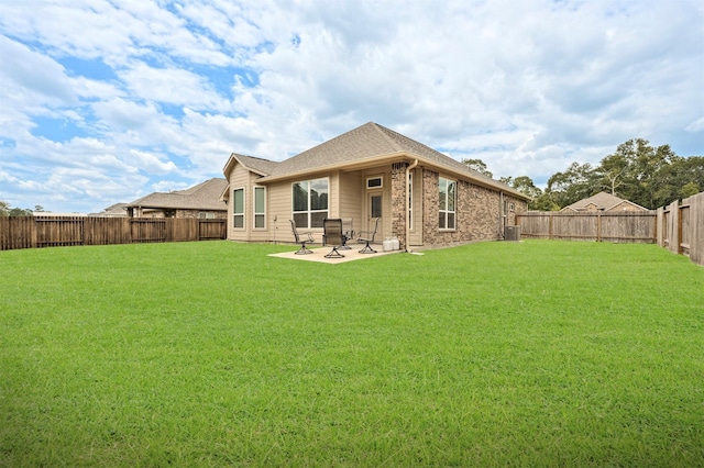 676 W Linnwood Dr, New Caney, TX 77357 - rear view of property with a patio, central AC, brick siding, and a shingled roof