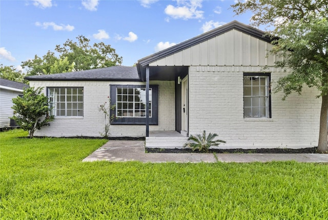 3805 19th St N, Texas City, TX 77590 - view of front of property with brick siding and a front yard