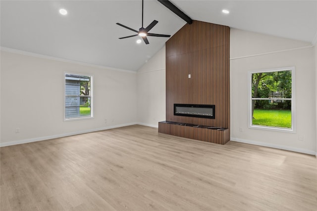 3805 19th St N, Texas City, TX 77590 - unfurnished living room with a large fireplace, plenty of natural light, ceiling fan, light wood finished floors, and high vaulted ceiling