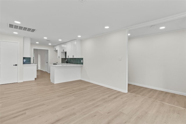 3805 19th St N, Texas City, TX 77590 - unfurnished living room with light wood-style flooring and recessed lighting