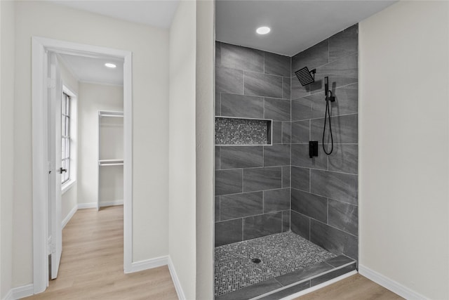 3805 19th St N, Texas City, TX 77590 - full bathroom with a tile shower, wood finished floors, baseboards, and recessed lighting