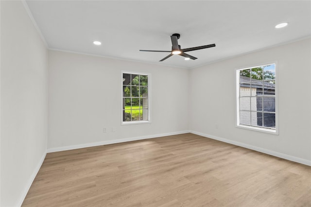 3805 19th St N, Texas City, TX 77590 - empty room featuring plenty of natural light, a ceiling fan, baseboards, light wood-type flooring, and crown molding