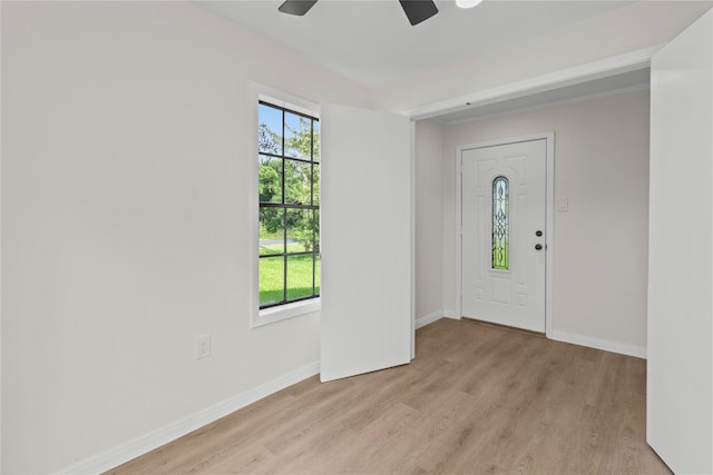 3805 19th St N, Texas City, TX 77590 - foyer featuring light wood finished floors, baseboards, and ceiling fan