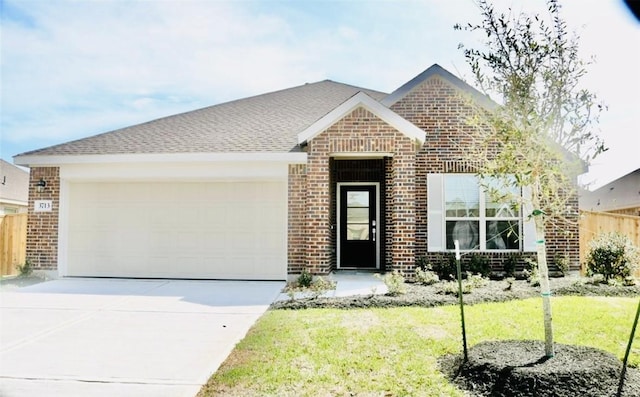 3713 NE River Sand Rd, Rosenberg, TX 77469 - view of front of property featuring brick siding, a garage, and driveway