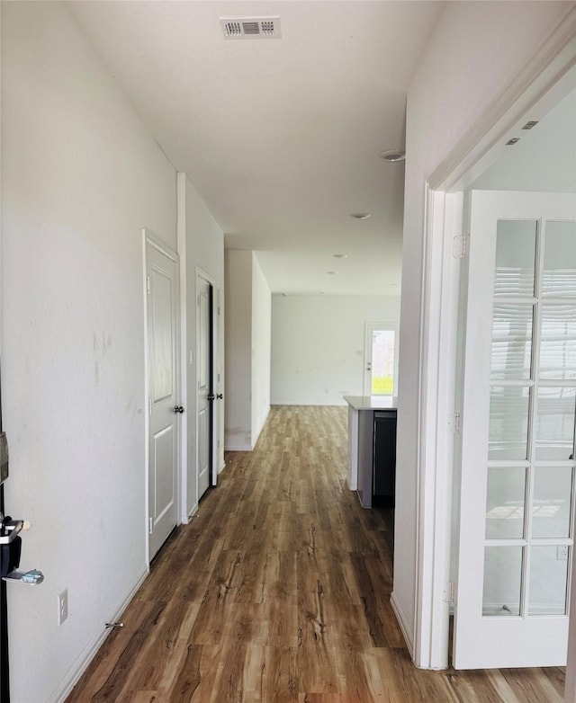 3713 NE River Sand Rd, Rosenberg, TX 77469 - corridor featuring wood finished floors
