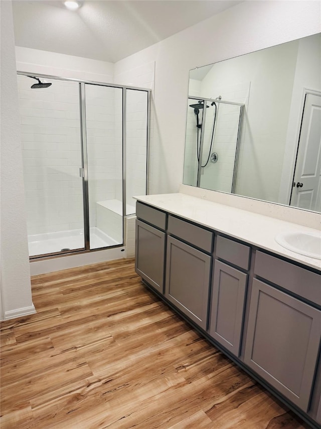 3713 NE River Sand Rd, Rosenberg, TX 77469 - full bath featuring a shower stall, double vanity, wood finished floors, and lofted ceiling