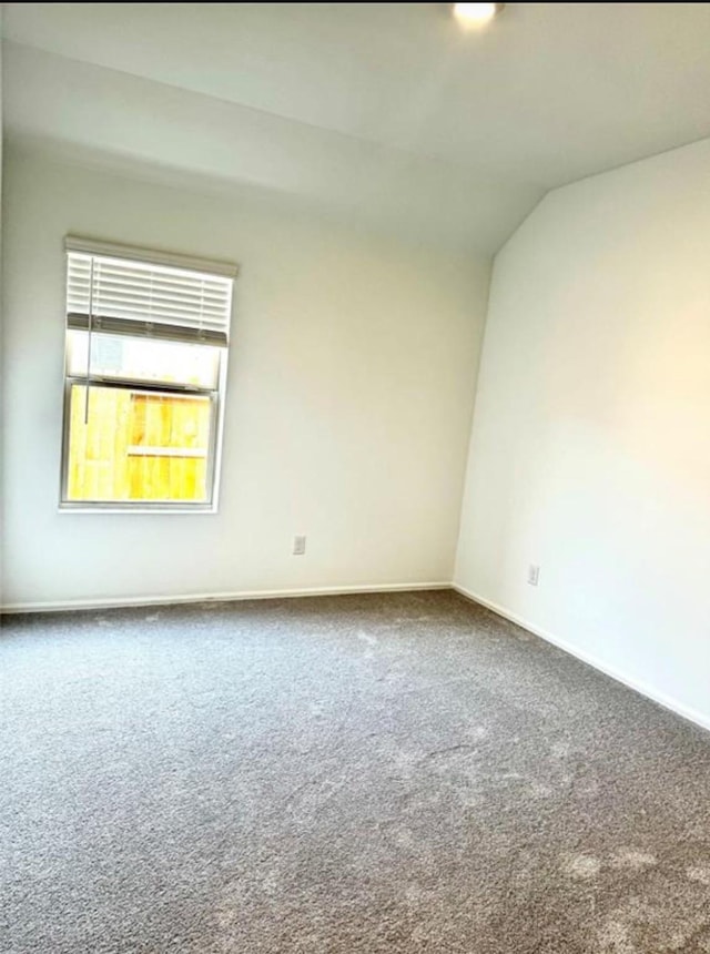 3713 NE River Sand Rd, Rosenberg, TX 77469 - unfurnished room with carpet flooring, baseboards, and vaulted ceiling