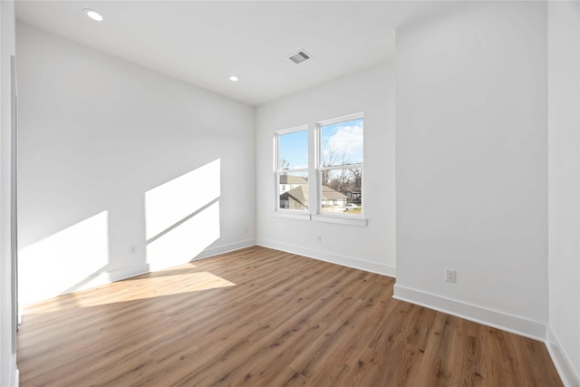7719 Orebo St, Houston, TX 77088 - empty room featuring wood finished floors, baseboards, and recessed lighting