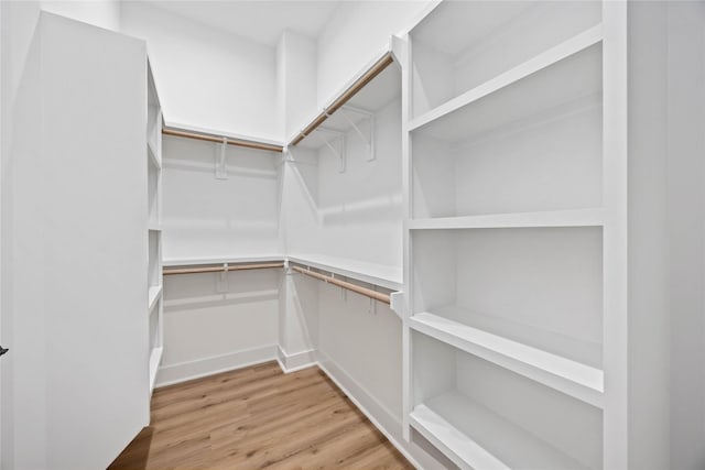 7719 Orebo St, Houston, TX 77088 - spacious closet featuring wood finished floors