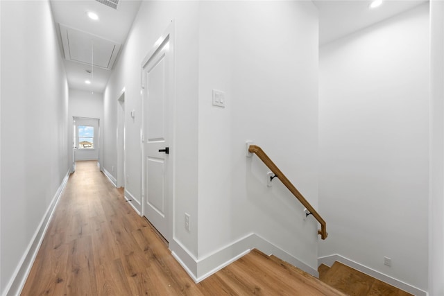 7719 Orebo St, Houston, TX 77088 - hallway with attic access, an upstairs landing, light wood-type flooring, baseboards, and recessed lighting
