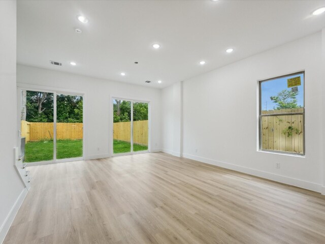 7416 Maxroy St, Houston, TX 77088 - unfurnished room featuring light wood-type flooring, recessed lighting, and baseboards