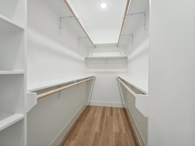 7416 Maxroy St, Houston, TX 77088 - spacious closet featuring wood finished floors
