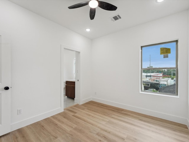7416 Maxroy St, Houston, TX 77088 - empty room featuring a ceiling fan, light wood-style floors, baseboards, and recessed lighting