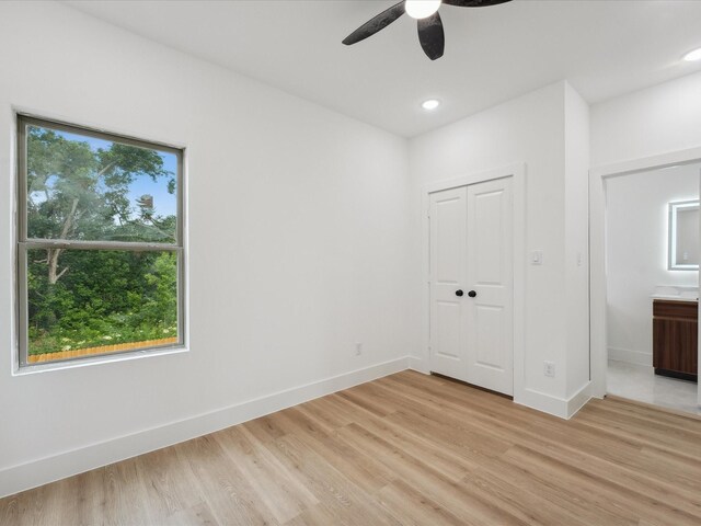 7416 Maxroy St, Houston, TX 77088 - unfurnished bedroom featuring light wood finished floors, baseboards, a closet, recessed lighting, and a ceiling fan