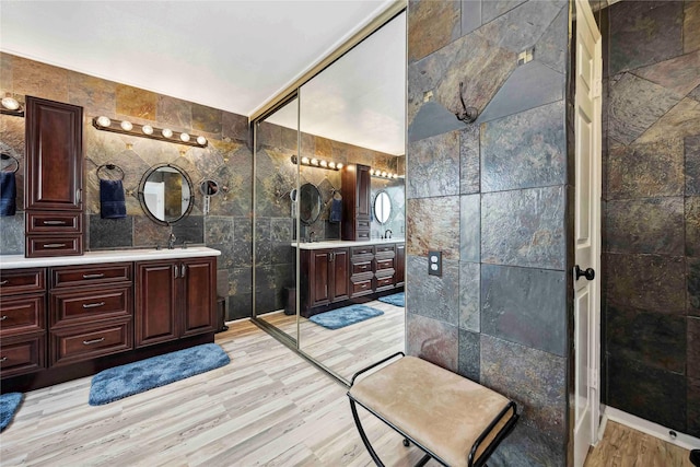 16019 Juniper Grove Dr, Houston, TX 77084 - full bath featuring tile walls, vanity, and wood finished floors
