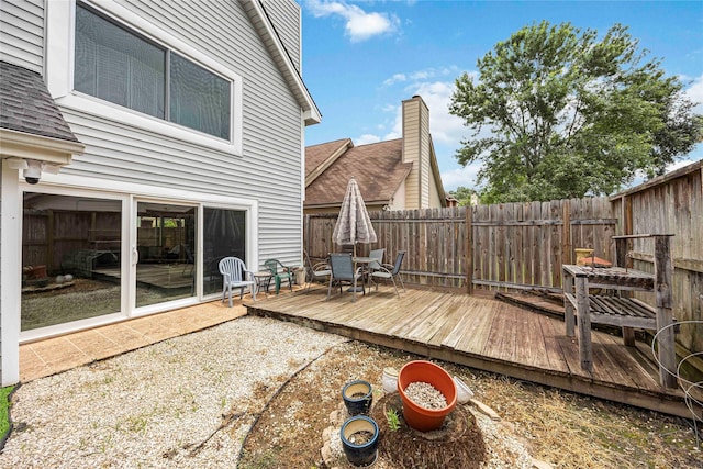 16019 Juniper Grove Dr, Houston, TX 77084 - wooden terrace with a fenced backyard and outdoor dining area