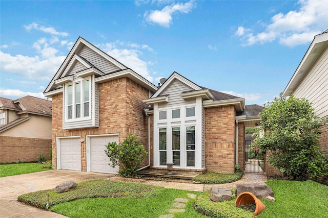 16019 Juniper Grove Dr, Houston, TX 77084 - view of front of house featuring brick siding, an attached garage, driveway, and roof with shingles
