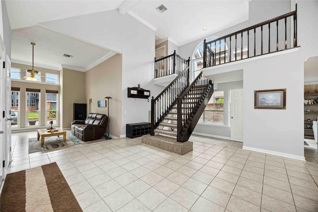 16019 Juniper Grove Dr, Houston, TX 77084 - entryway with high vaulted ceiling, light tile patterned floors, stairway, ceiling fan, and baseboards