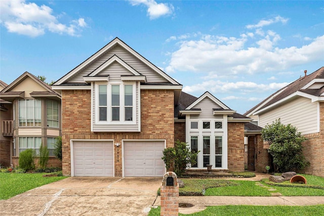 16019 Juniper Grove Dr, Houston, TX 77084 - view of front facade with brick siding, a garage, and driveway