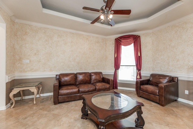 16206 Lobo Ln, Spring, TX 77379 - living area featuring a tray ceiling, ceiling fan, wallpapered walls, and crown molding