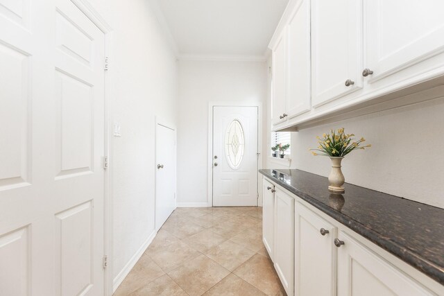 16206 Lobo Ln, Spring, TX 77379 - washroom featuring ornamental molding and light tile patterned floors