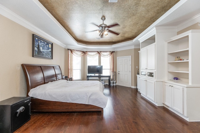 16206 Lobo Ln, Spring, TX 77379 - bedroom with a raised ceiling, dark wood-style floors, crown molding, ceiling fan, and baseboards