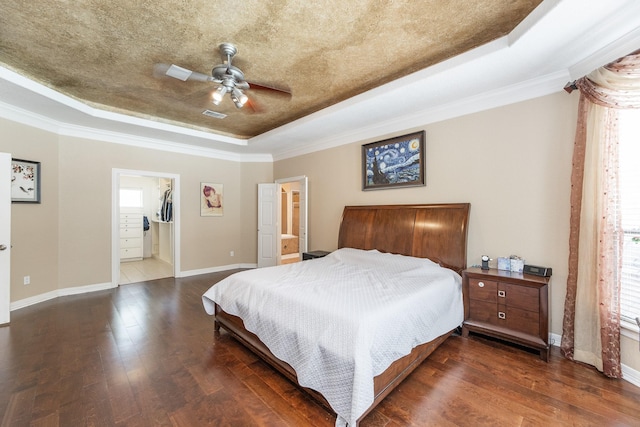 16206 Lobo Ln, Spring, TX 77379 - bedroom with a raised ceiling, dark wood-style flooring, baseboards, crown molding, and ceiling fan