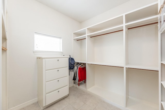 16206 Lobo Ln, Spring, TX 77379 - walk in closet featuring light tile patterned floors