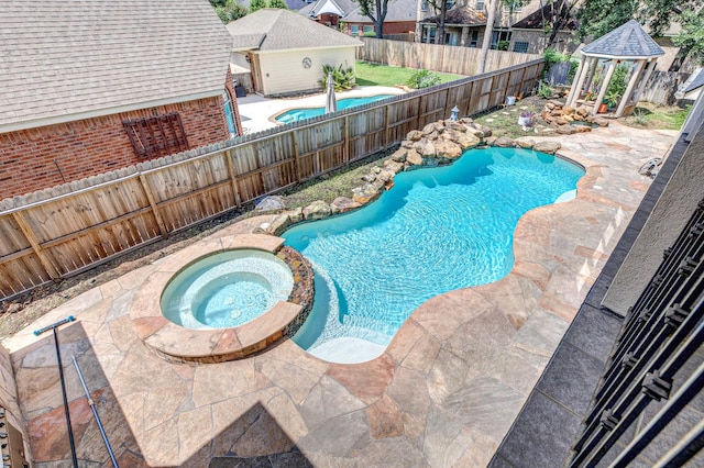 16206 Lobo Ln, Spring, TX 77379 - view of swimming pool with a gazebo, a fenced backyard, a patio, and a pool with connected hot tub