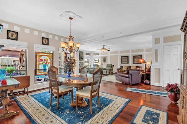 3407 Gold Candle Dr, Spring, TX 77388 - dining room with wood finished floors, a chandelier, and a ceiling fan