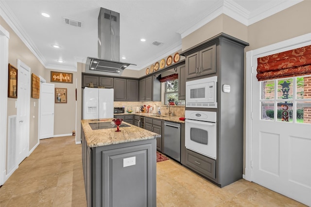 3407 Gold Candle Dr, Spring, TX 77388 - kitchen with white appliances, island range hood, ornamental molding, a center island, and gray cabinets