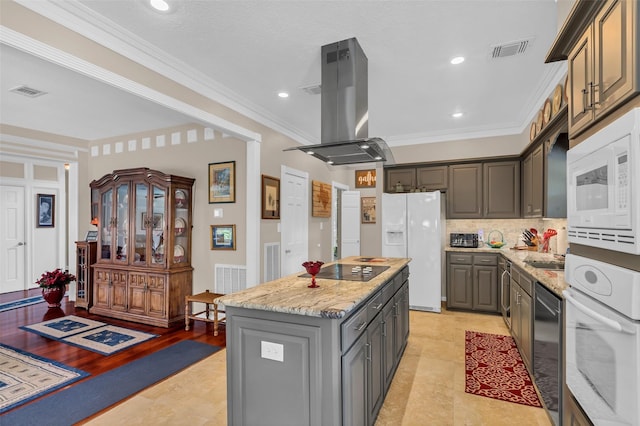 3407 Gold Candle Dr, Spring, TX 77388 - kitchen featuring island range hood, white appliances, a center island, crown molding, and gray cabinetry