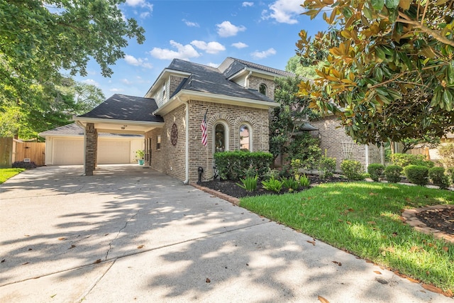 3407 Gold Candle Dr, Spring, TX 77388 - view of front of house featuring brick siding, a garage, driveway, and a shingled roof