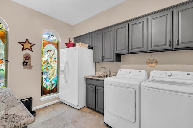 3407 Gold Candle Dr, Spring, TX 77388 - laundry room with washer and dryer, cabinet space, and baseboards