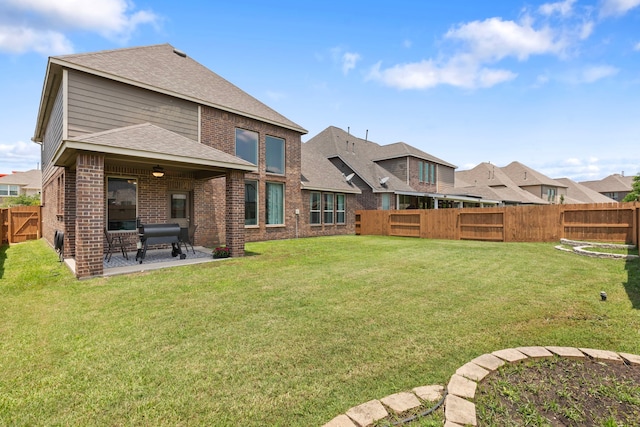 9414 Peralta Creek Ct, Cypress, TX 77433 - back of house featuring brick siding, a patio area, and a shingled roof