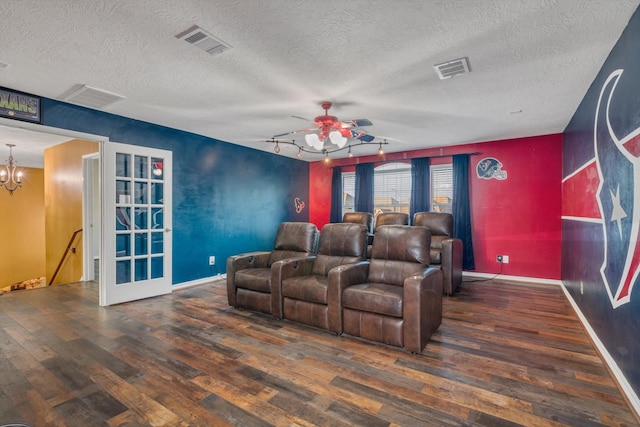 2402 Leslie Ln, Deer Park, TX 77536 - cinema room featuring hardwood / wood-style flooring, a textured ceiling, a chandelier, ceiling fan, and baseboards